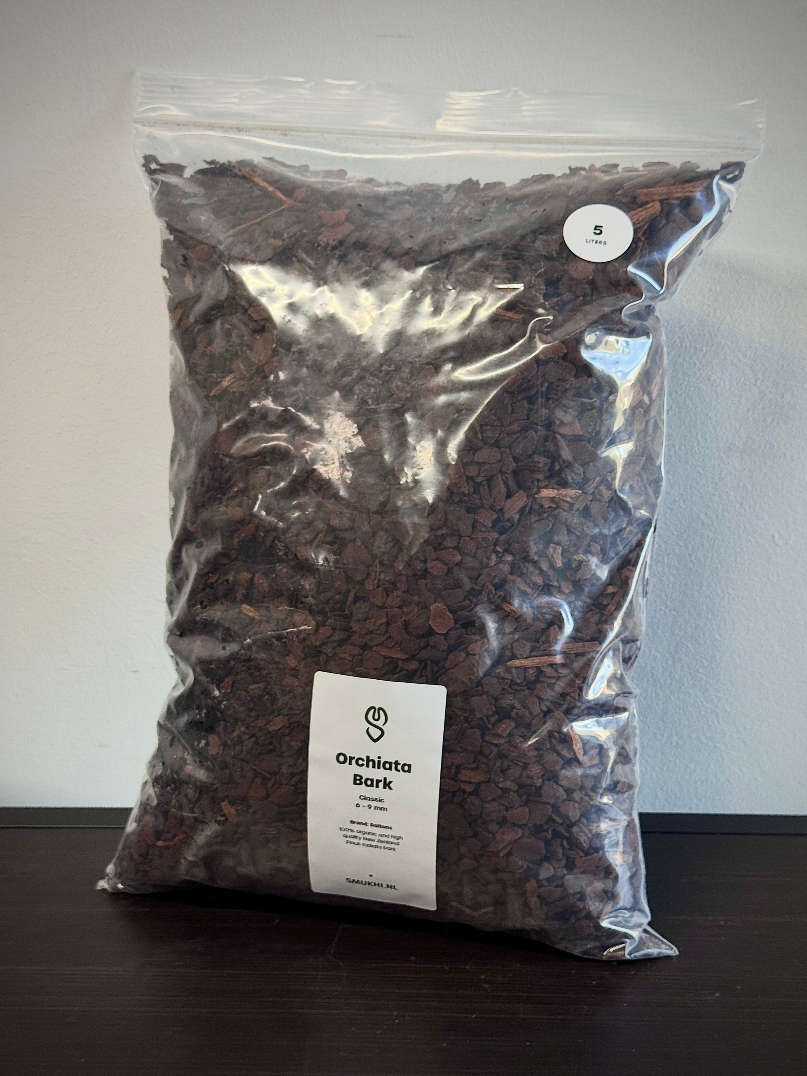 Daltons Orchiata Bark substrate in a bag, showing finely shredded, natural orchid-growing bark for healthy plant roots.