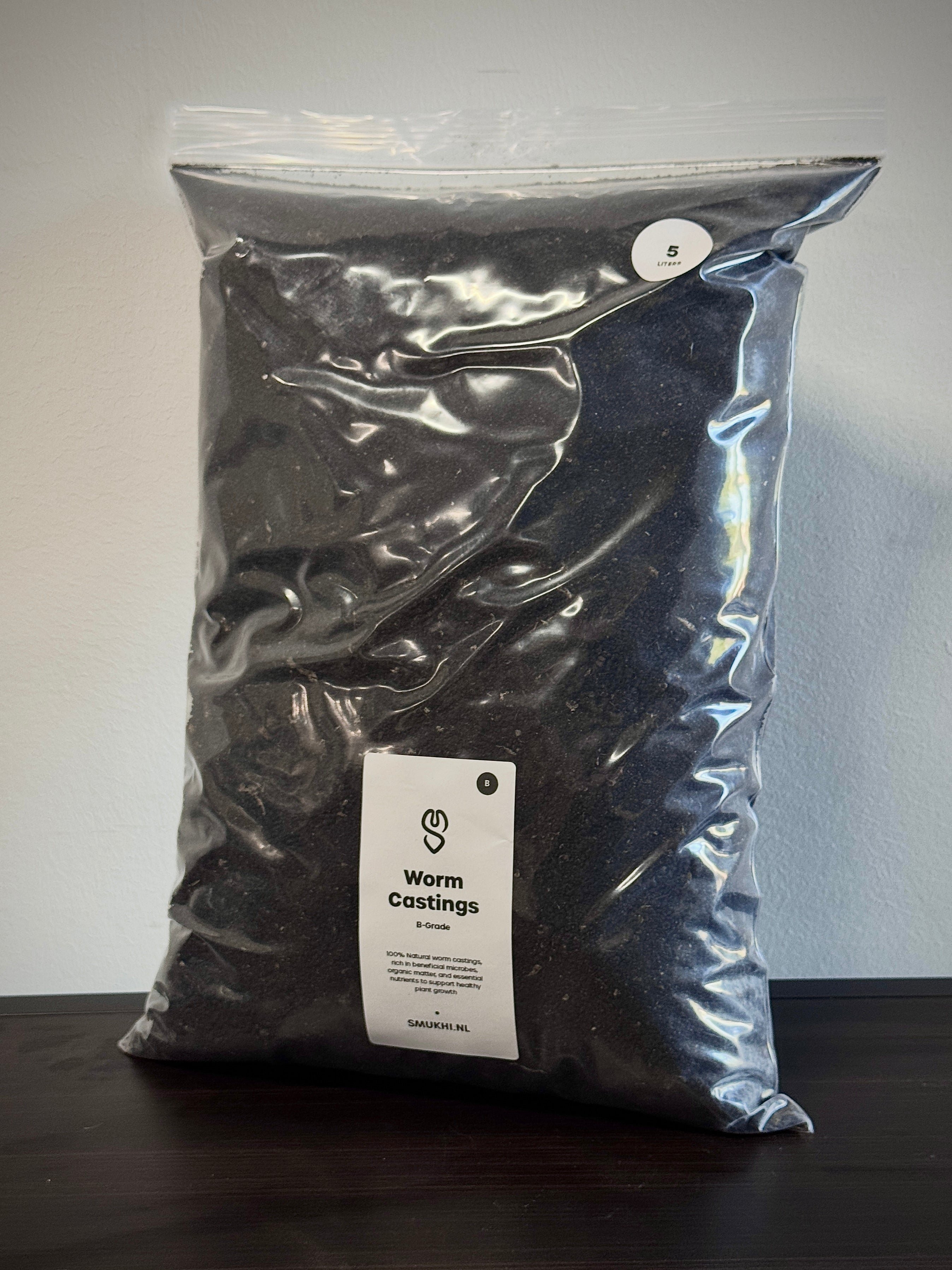 SMUKHI worm castings substrate showing rich, dark organic soil ideal for gardening and plant growth.