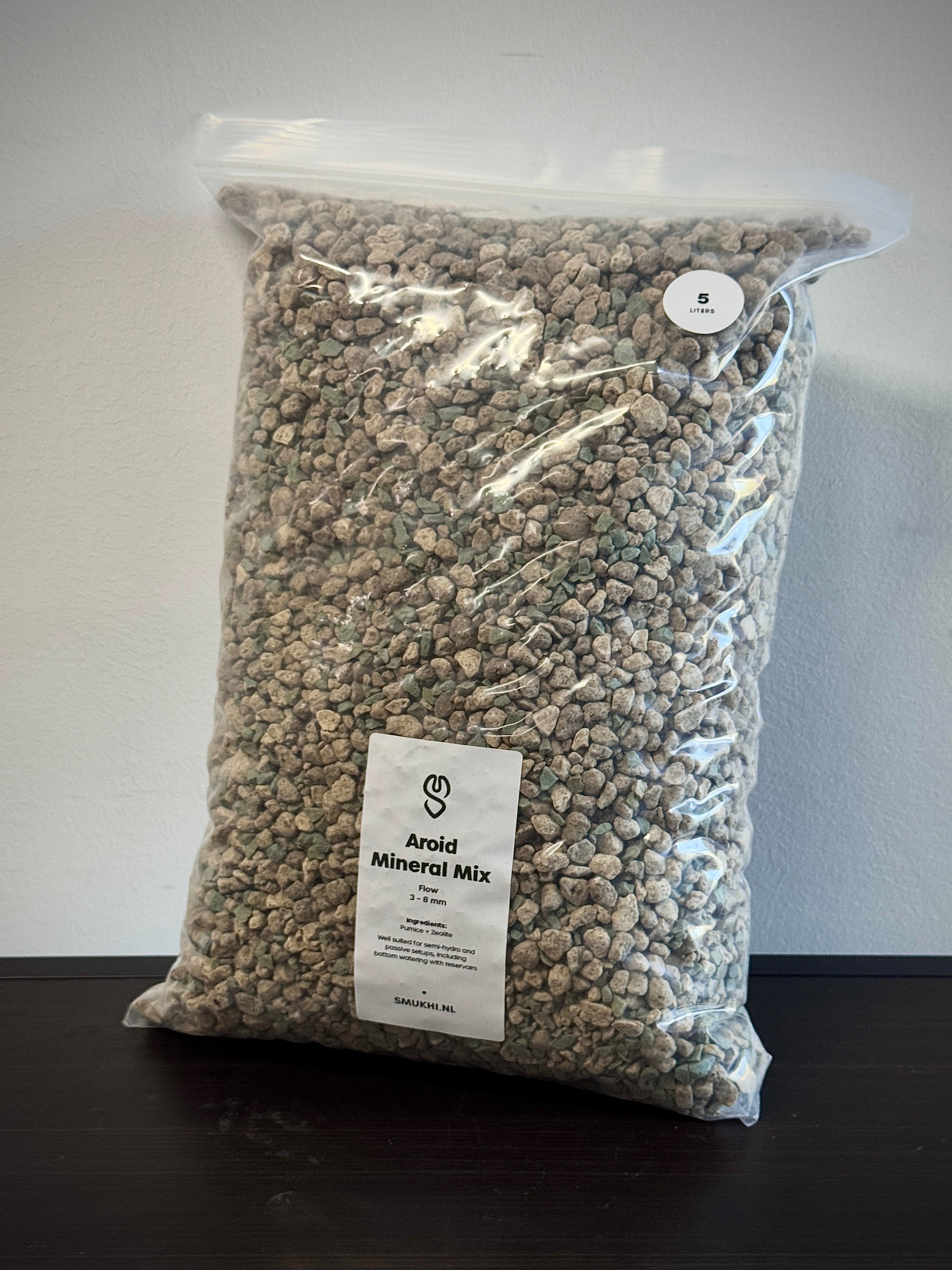 SMUKHI Mineral Mix semi-hydro substrate for plants, showing the textured, mineral-rich soil in the image.