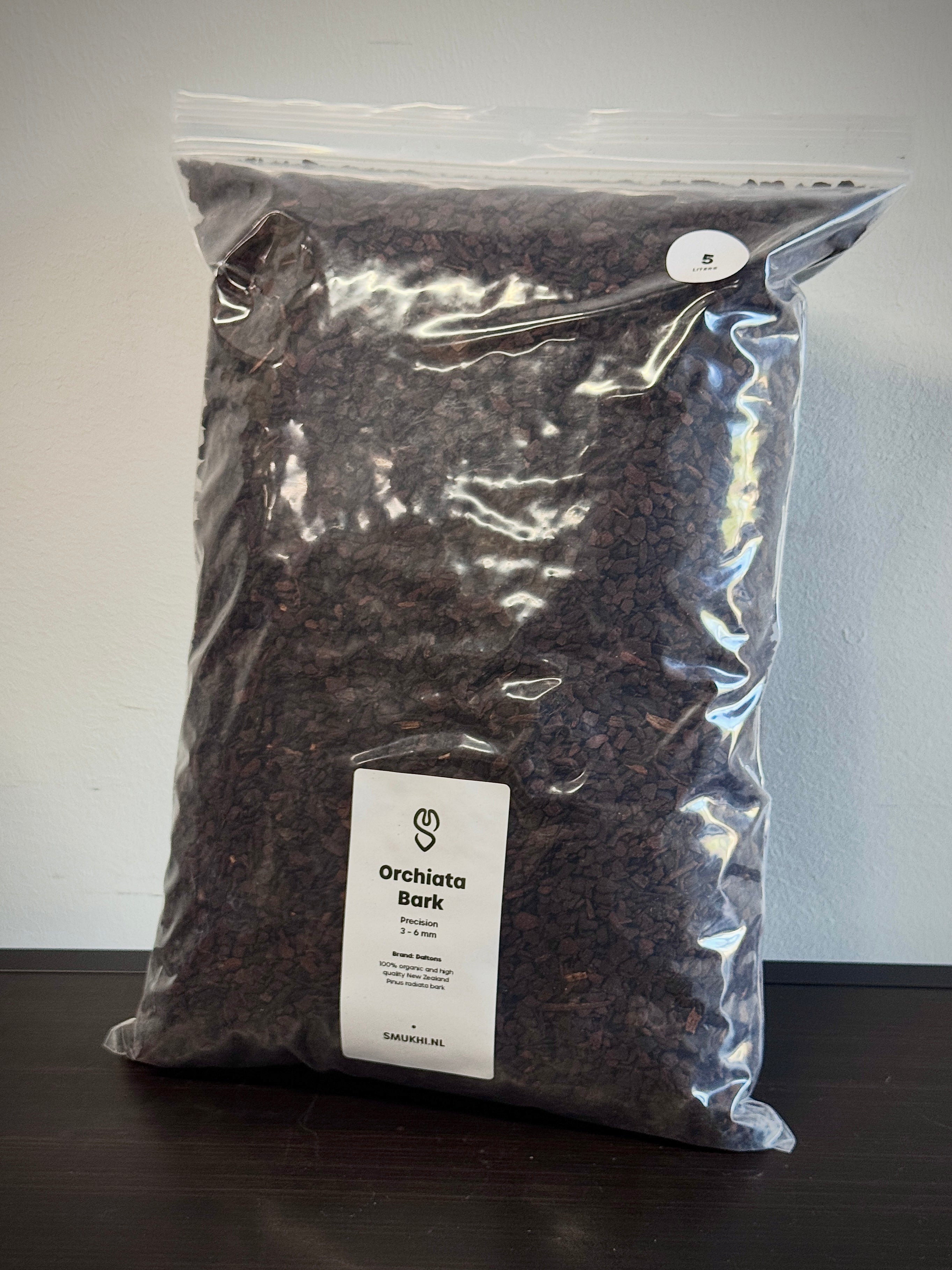 Daltons Orchiata Bark substrate in a bag, showing coarse, natural orchid potting bark for healthy plant growth.