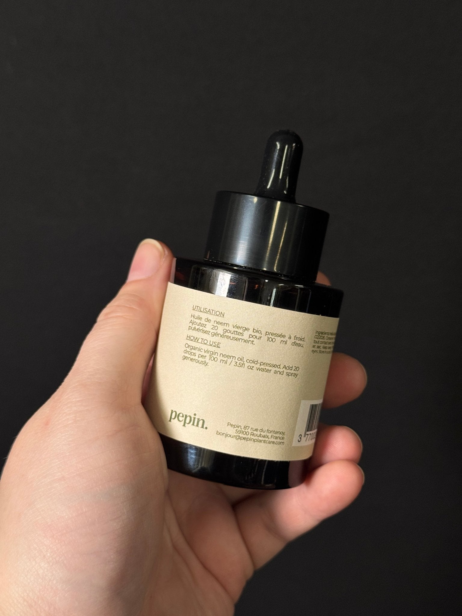 Virgin Neem Oil from PEPIN, natural insecticide for pest control, shown in a clear bottle with a dropper cap.