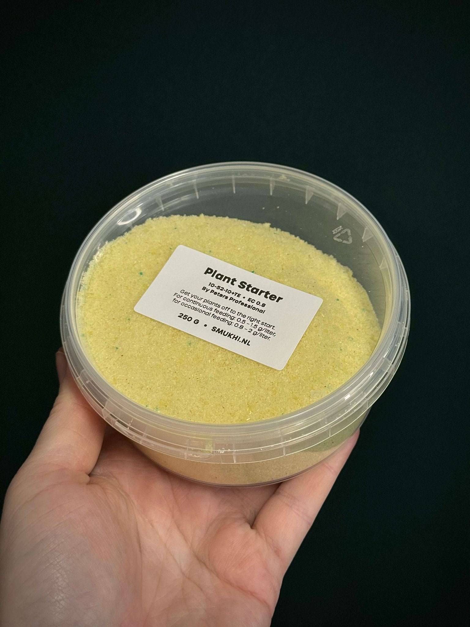 Peters Professional Plant Starter fertilizer 10-52-10 granular formula in a white bag with green and yellow labeling.