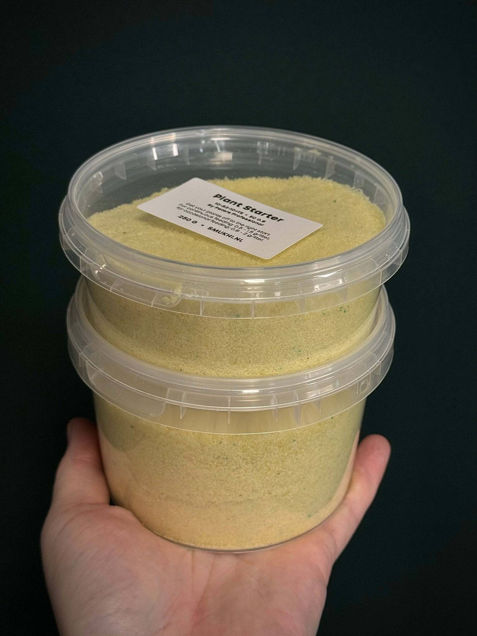 Peters Professional Plant Starter fertilizer 10-52-10 in a container, designed to promote healthy plant growth.