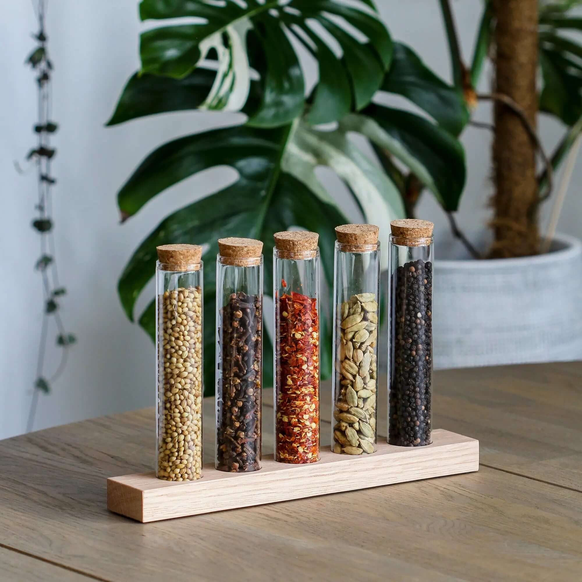 SMUKHI multifunctional propagation station with three oak wood tubes, serving as a spice rack and plant propagation stand.